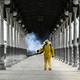 A serviceman of Russia’s Emergencies Ministry wearing protective gear disinfects Moscow’s Belorussky railway station on October 20, 2021.